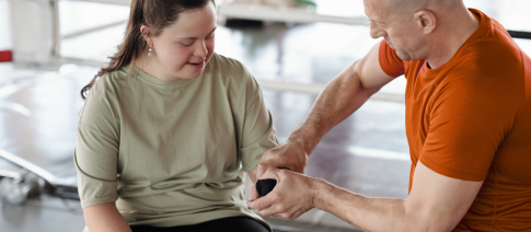 training-coach-with-down-syndrome-lady-in-boxing-gym-branded.png